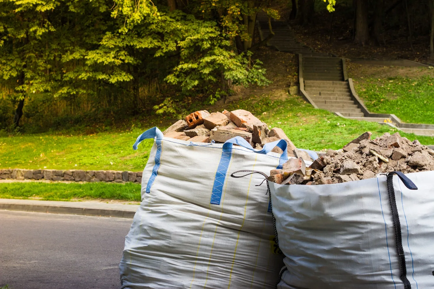 Bulk bags of sorted pool demolition rubble ready for recycling